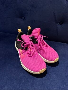 Nike Women’s Bright Pink Athletic Sneakers with Black and Yellow Accents